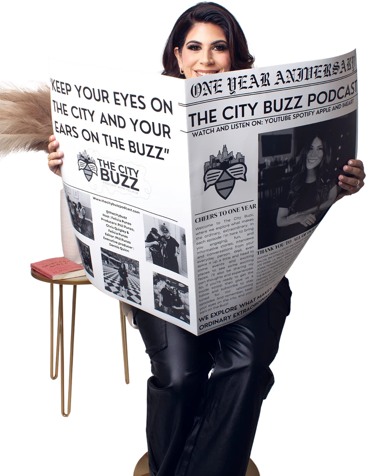 Felicia reading The City Buzz newspaper